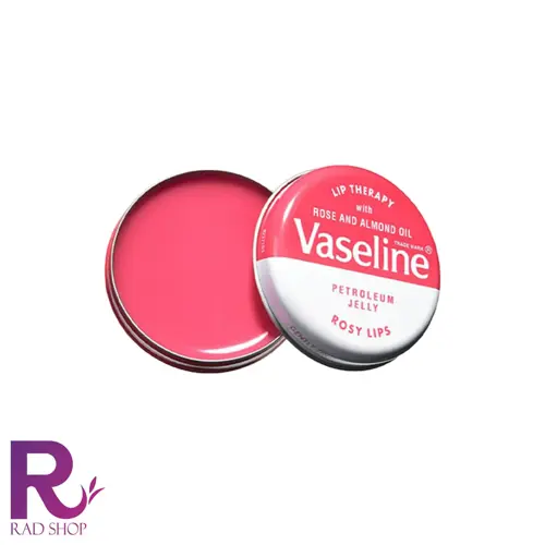 بالم لب کاسه ای وازلین، قوطی گرد باز حاوی بالم صورتی در کنار در فلزی با نوشته Vaseline، روی زمینه سفید